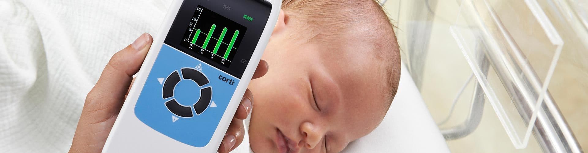 An infant being evaluated for otoacoustic emissions with the GSI Corti